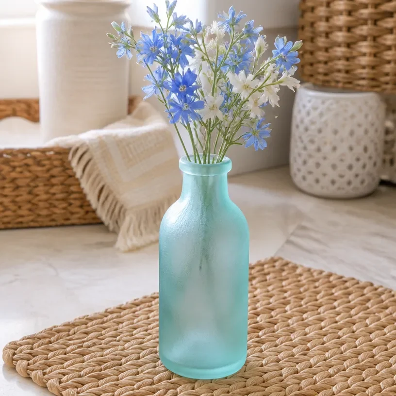Stylish bud vase featuring a faux sea glass finish, ideal for home decor.